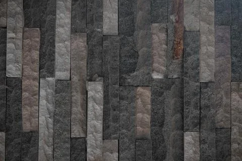 Stone wall texture background - grey stone siding with different sized stones Stock Photos