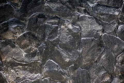 Stone wall texture background - grey stone siding with different sized stones Stock Photos