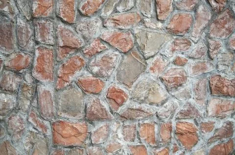 Stone wall texture background of grey brick stones. Stock Photos