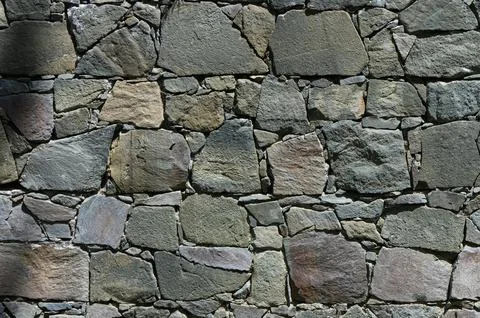 Stone wall texture background - grey stone with different sized stones 1 Stock Photos