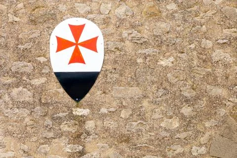Stone wall texture background with medieval coat of arms Stock Photos