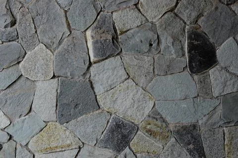 Stone wall texture background random shape, gray, light blue and black Stock Photos