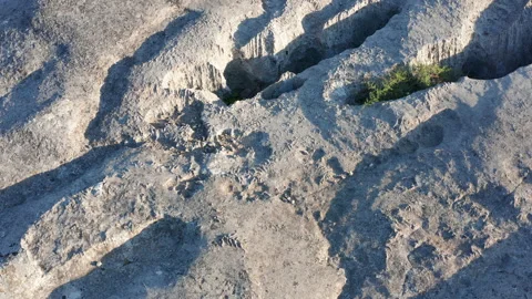 Stone wall texture - bare wrinkled rock with holes Stock Footage 133159120