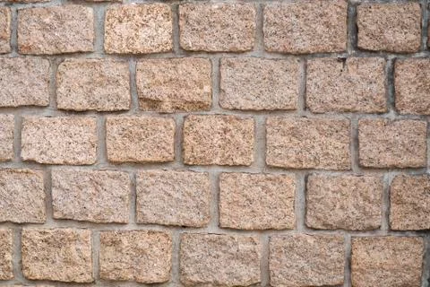 Stone wall texture: brown, orange, terracotta. Stone blocks.  Brown brick wal Stock Photos