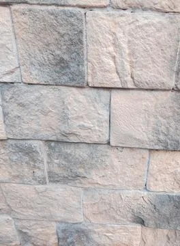 Stone wall texture close up light gray masonry vertical Foto stock