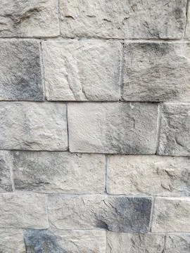 Stone wall texture close up light gray masonry vertical Foto stock