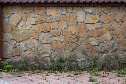 Stone wall texture in the courtyard Stock Photos
