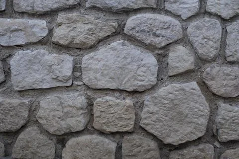 Stone wall texture. Decorative wall background with mosaic stones. Antique st Stock Photos
