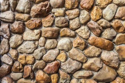 Stone wall Texture of different forms stones similar to wall Stock Photos