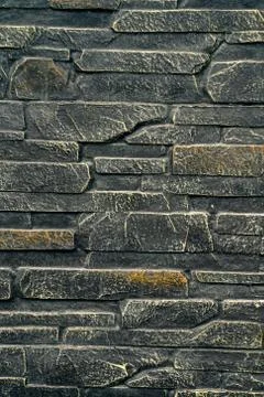 Stone wall texture with the effect of aging and bronzing Stock Photos