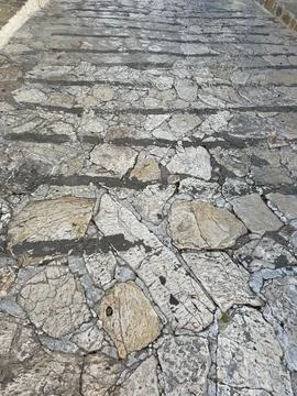 Stone wall texture forming an abstract pattern with various shapes and shad.. 写真素材