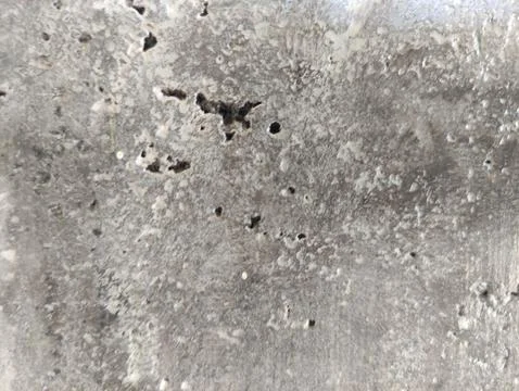 The Stone wall texture is gray with a medium level of roughness Stock Photos