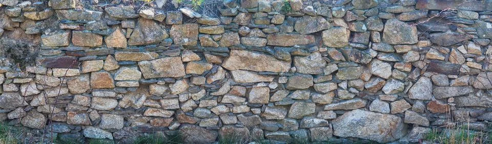 Stone wall - texture of an old wall Stock Photos