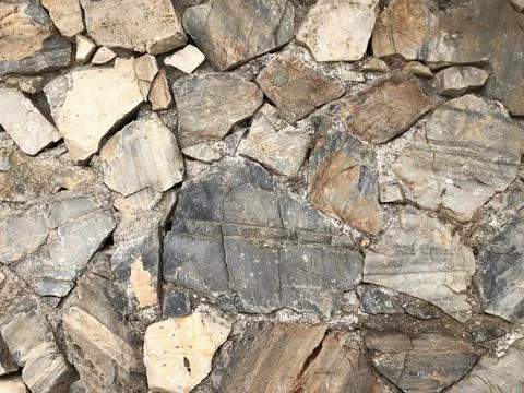 Stone wall for texture or background Stock Photos