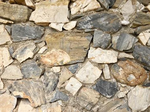Stone wall for texture or background, close-up details Stock Photos