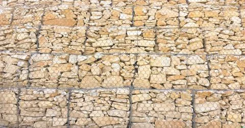 Stone wall texture. Rock wall background. Stock Photos
