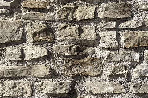 Stone wall texture, rough rectangular rock bricks Stock Photos
