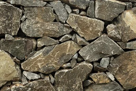 Stone wall, Texture of a stone wall. Stone wall texture background, rock wall Stock Photos