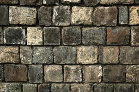 Stone wall, Texture of a stone wall. Stone wall texture background. Stock Photos