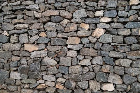 Stone wall, Texture of a stone wall. Stone wall texture background, rock wall Stock Photos