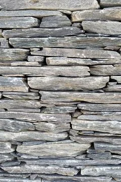 Stone wall, Texture of a stone wall. Stone wall texture background, rock wall Stock Photos