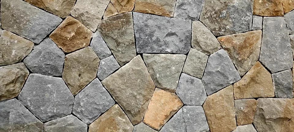 Stone wall, Texture of a stone wall. Stone wall texture background, rock wall Stock Photos