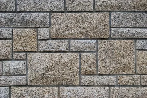 Stone wall texture with straight cuts in different shapes Stock Photos