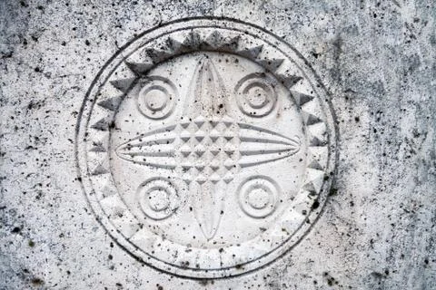 Stone wall texture with symbol Stock Photos