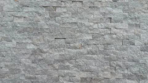 Stone wall texture with uniform gray bricks suitable for use as a seamless .. Stock Footage 335158065