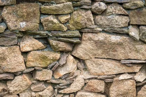 Stone wall - texture of a wall built of stones Stock Photos