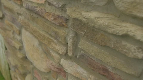 Stone wall tilt from bottom to top close Stockbeeldmateriaal 95038717