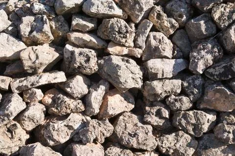 Stone wall with very sharp shadows. Stock Photos