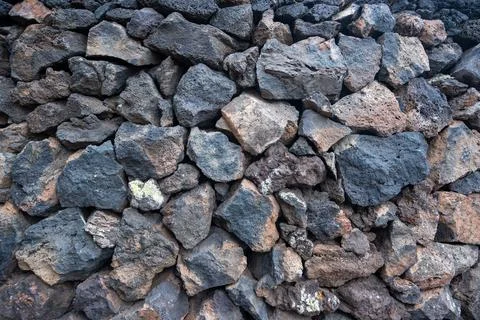 Stone wall, volcanic stone background Stock Photos