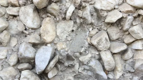 Stone wall - A wall of small white stones Stock Footage 156332175
