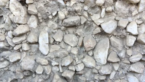 Stone wall - A wall of small white stones Stock Footage 156332194