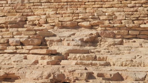 The stone wall that the white bird flew into. Stock-Footage 264975524