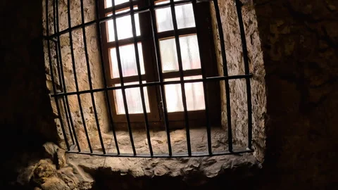 Stone wall with window and bars Stock Footage 306693054
