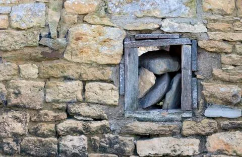 Stone wall with window background Stock Photos