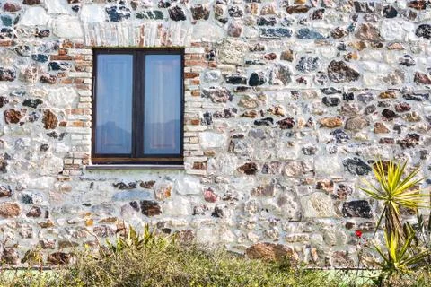 Stone wall with window Stock Photos