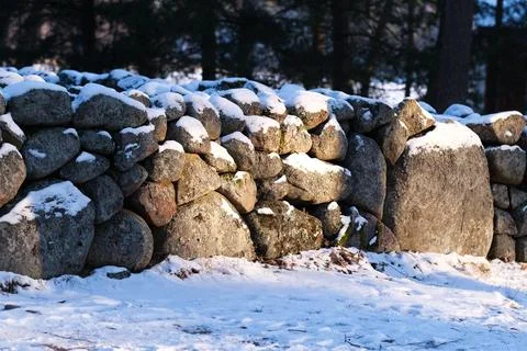 Stone wall in winter Stock Photos