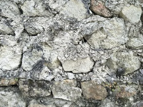 Stone walls that have a solid texture with patterns and layers of cement Stock Photos