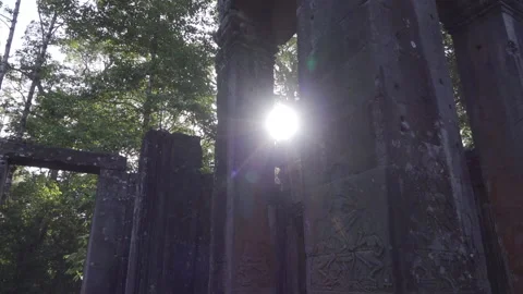 Stone walls slide move right sun rays in out columns ancient ruins Видео 229825627
