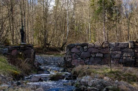 Stone walls on the small river Stock Photos