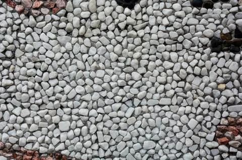 Stone wallTexture consisting of small pebbles embedded in cement. Background. Foto stock
