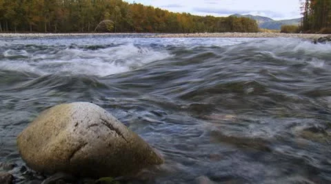 Stone washed by fast mountain river in the autumn forest in Siberia. Stock Footage 8948500