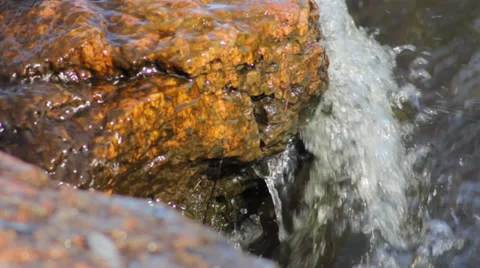 Stone washed by mountain river Stock Footage 37270986