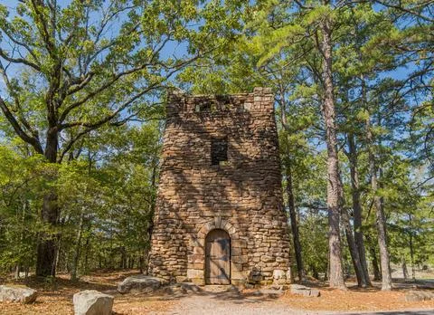 Stone water tower in forest Stock Photos