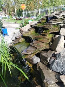 Stone waterfall in the garden Foto stock