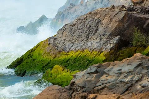 Stone in waterfall in Laos. Stock Photos