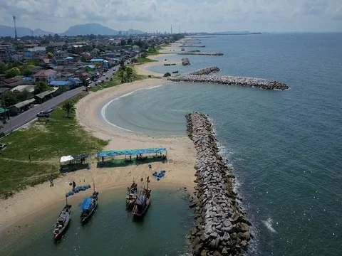 Stone wave breaker into the sea at Map ta phut Industrail Estate, Rayong Stock Footage 77443264